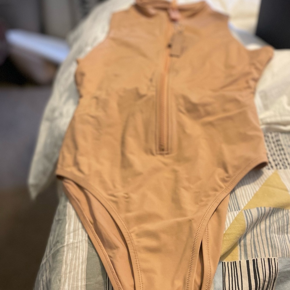 New with tags Skims sleeveless swimsuit.